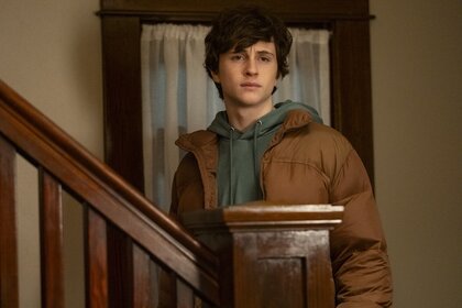 Max Hawthorne (Judah Prehn) stands on a staircase on Resident Alien Episode 402.